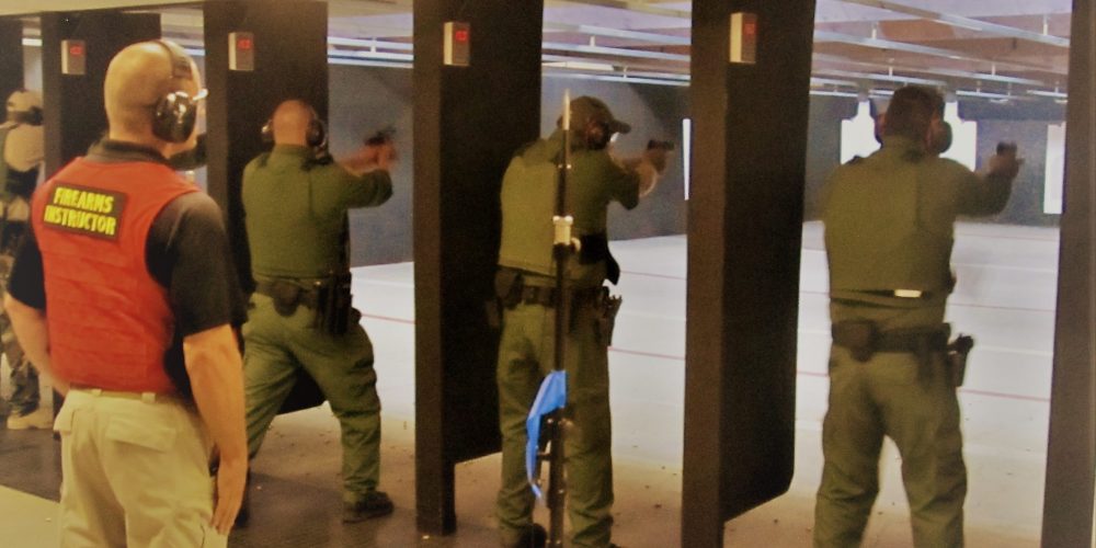 Federal_law_enforcement_officers_during_firearms_training_exercises_at_indoor_firing_range (2)